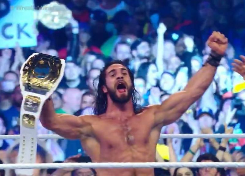 Rollins, the newly minted grand slam champion, holds his prize.