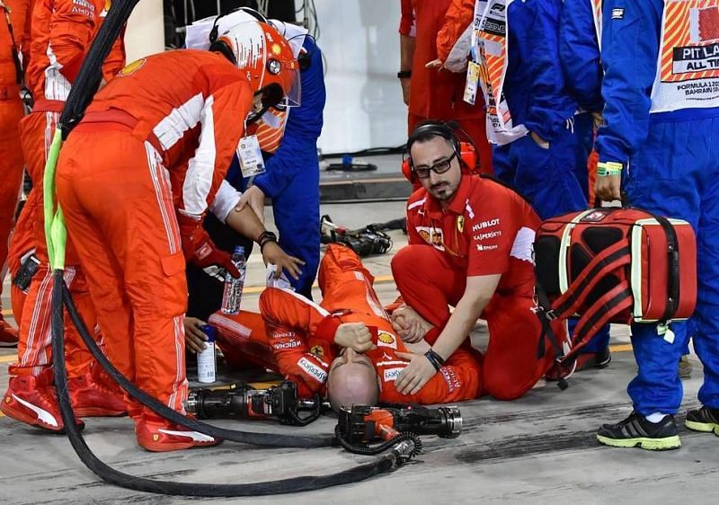Physicians tending to the injured Ferrari mechanic