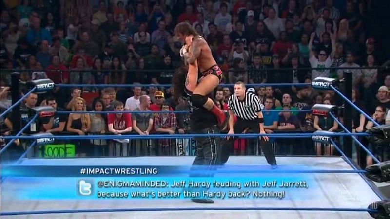 Abyss lifts his victim in a Hangman&#039;s choke hold.