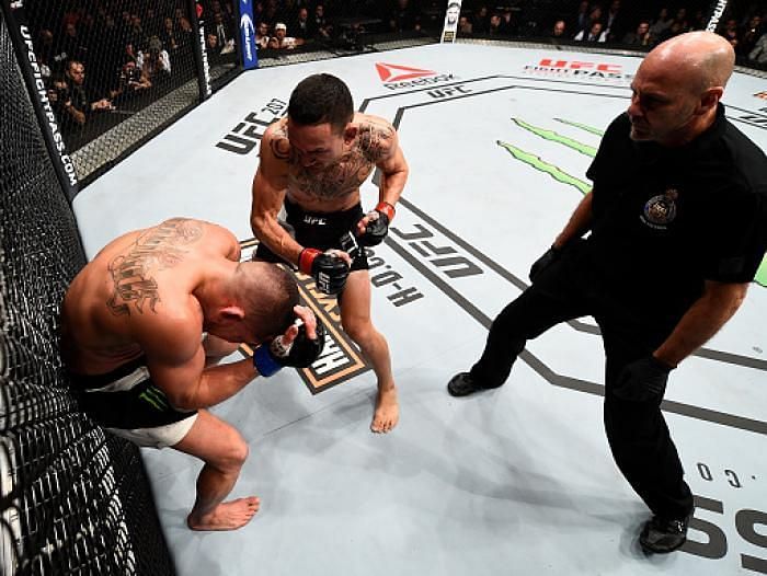 Max Holloway finishing a helpless Pettis at UFC 206