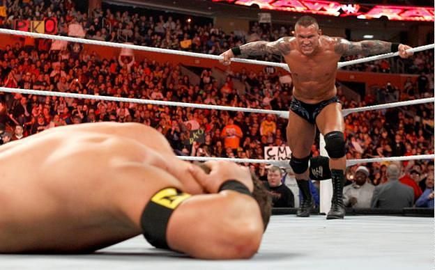 Randy Orton prepares to punt kick John Cena