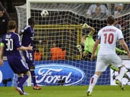 Watching the result of his wonder strike.