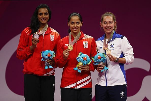 Gold medalist Saina Nehwal of India, silver medalist Venkata Pusarla of India and bronze medalist Kirsty Gilmour of Scotland in the womens singleson the winners podium