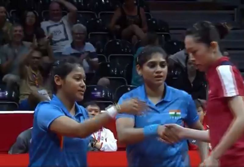 Mouma and Madhurika shaking hands with their opponents after the win