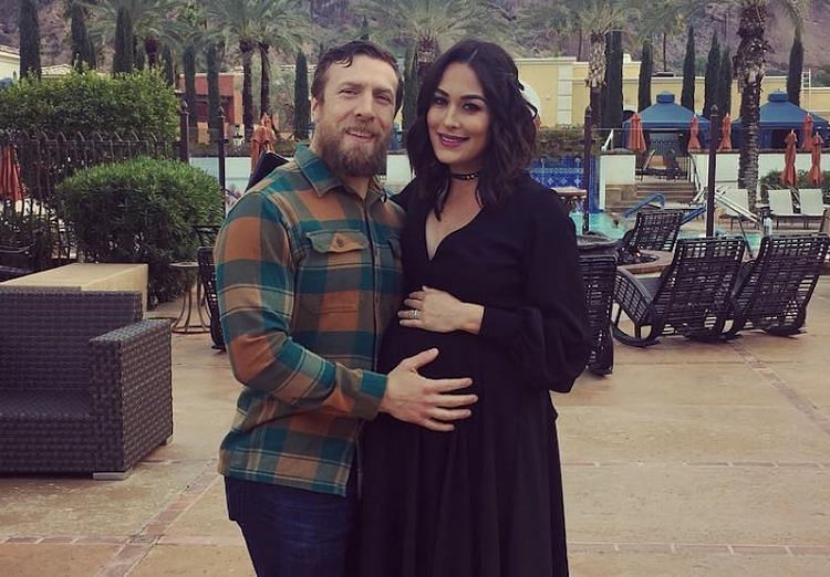 Bryan and Brie pose with a prenatal Birdie Joe.