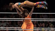 Kavita Devi lifting Dakota Kai above her head