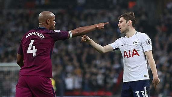 Davies and Kompany argue after a foul on the latter by the Welshman