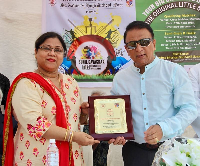 Mr. Gavaskar receiving a memento from Ms. Jennifer Dias. Principal of St. Xavier&#039;s High School, Fort 