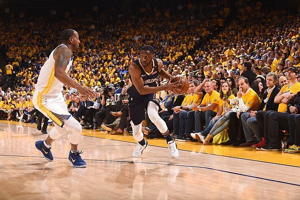 Ian Clark (right) drives to the basket