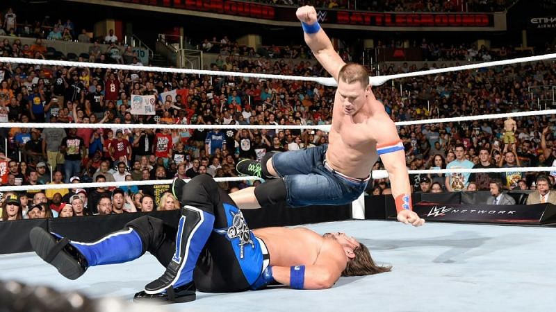 John Cena hits AJ Styles with the Five Knuckle Shuffle