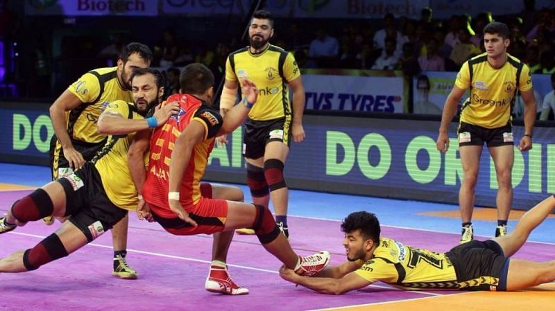 Vishal Bharadwaj attempts an ankle hold on Ajay Kumar 