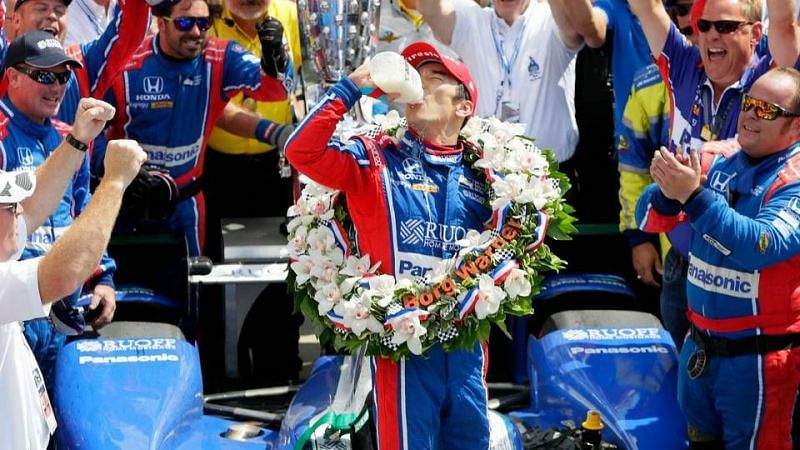 Takuma Sato celebrating his Indy 500 win in 2017