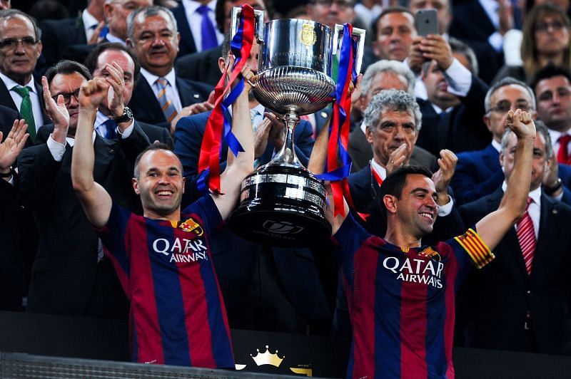 (From left)Andres Iniesta and Xavi Hernandez of Barcelona celebrate with the Copa-del-Rey trophies, one of the six titles they clinched in 2014-15.