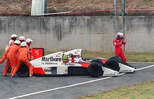 Ayrton Senna of Brazil is given a push f