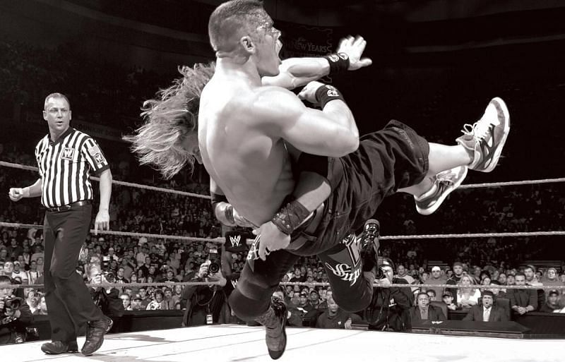 Edge spears the championship away from John Cena!