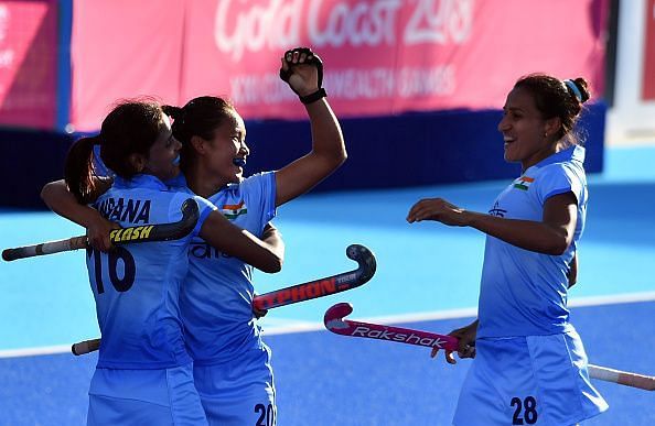 India&#039;s Lalremsiami celebrates after scoring a goal against Malaysia with teammates Vandana Katariya and Rani