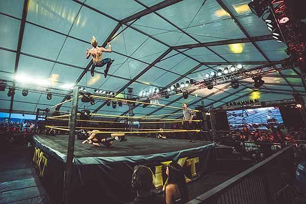 Mark Andrews performs a shooting star press at an NXT event during the UK&#039;s Download Festival