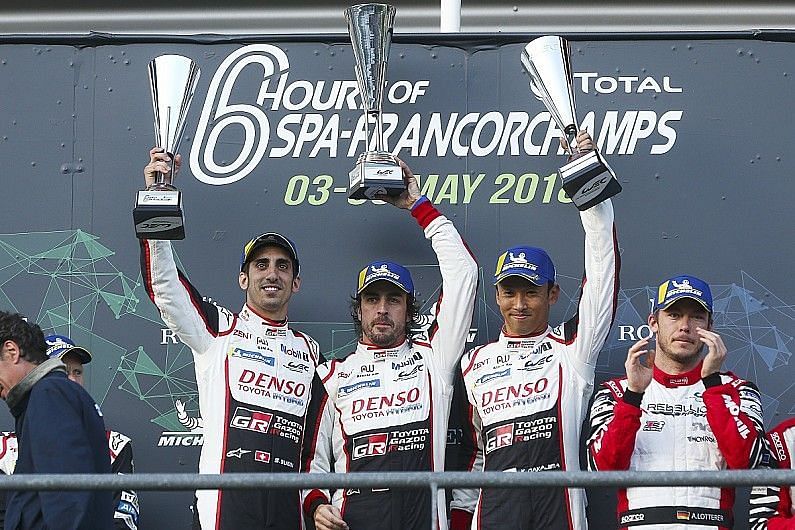 Fernando Alonso celebrating his 6hrs of Spa win alongside Sebastian Buemi and Kazuki Nakajima