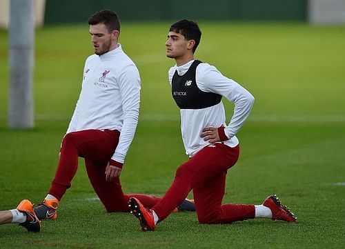 Yan Dhanda alongside teammate Andrew Robertson