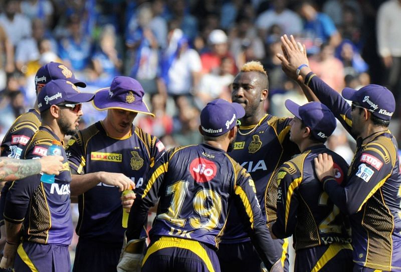 Kolkata Knight Riders players celebrate the fall of a wicket