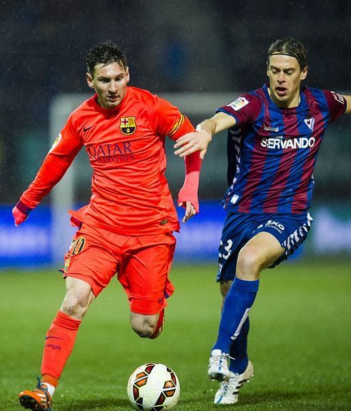 Javi Lara vies for the ball with 5 time Balon do&#039;r and European golden shoe winner Lionel Messi