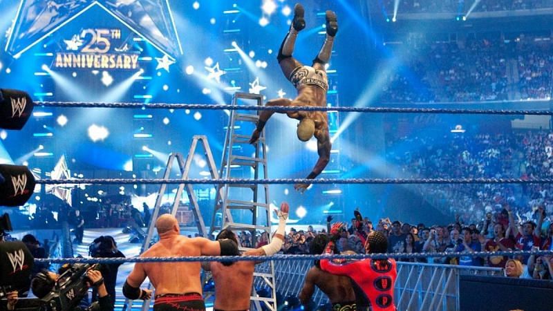 Shelton Benjamin dives off the ladder onto waiting opponents