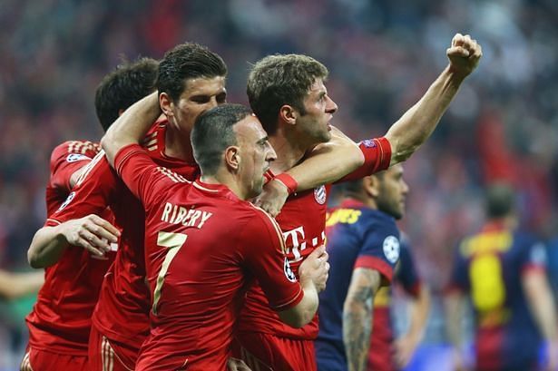 Muller celebrates with his team-mates after scoring the opener against Barcelona in the UCL semifinals