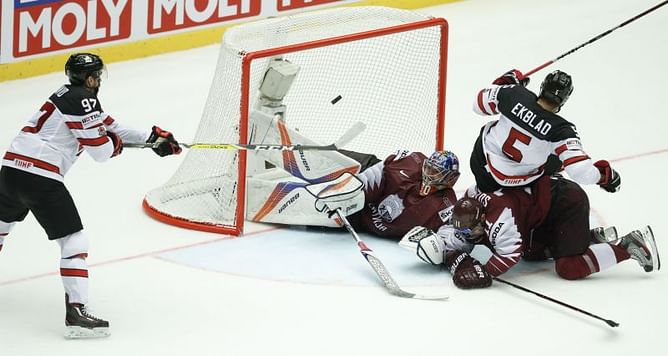 Canada beats Latvia in OT, Czechs edge Austria at ice hockey