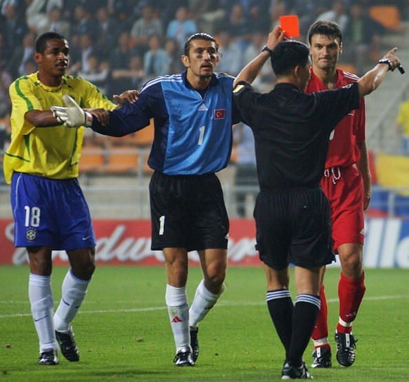 Referee Kim Young Joo gives a red card to Turkey&#039;s