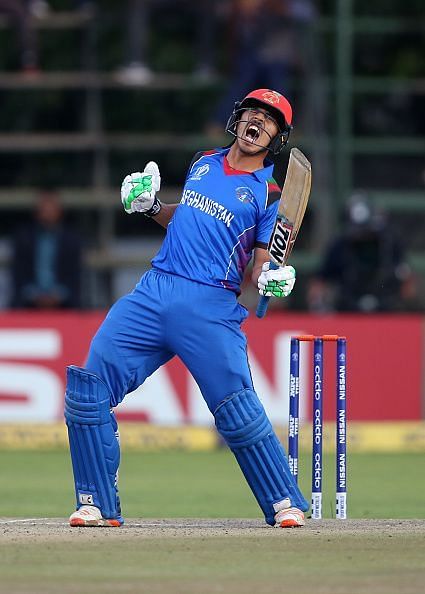 Sharafuddin Ashraf celebrates his team's victory in the ICC Cricket World Cup Qualifier match against West Indies