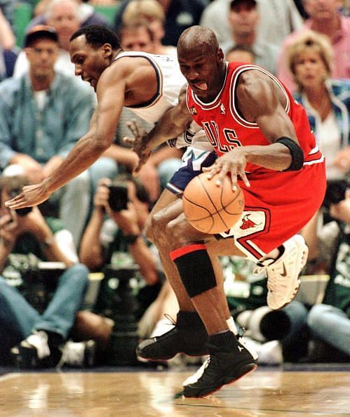Michael Jordan (R) of the Chicago Bulls steals the