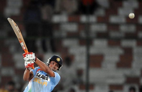 Indian cricketer Suresh Raina hits a bou