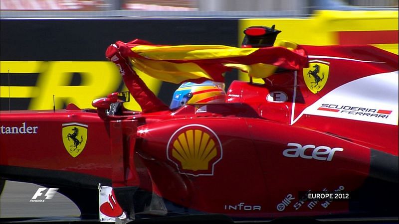 Alonso waiving Spanish Flag