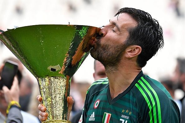 Buffon lifting the Serie A title with Juventus