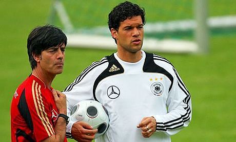 Low instructing Ballack in training session 
