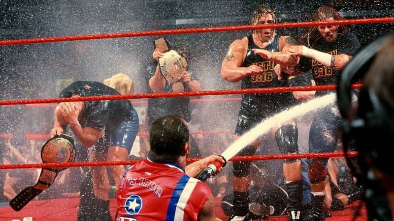 Kurt Angle spraying the Alliance