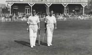 Cricket. Circa 1930+s. A picture of the legendary England batting pair of JB (John 'Jack' Berry) Hobbs (Surrey) and Herbert Sutcliffe (Yorkshire) walking out to bat at the Scarborough Cricket Festival.