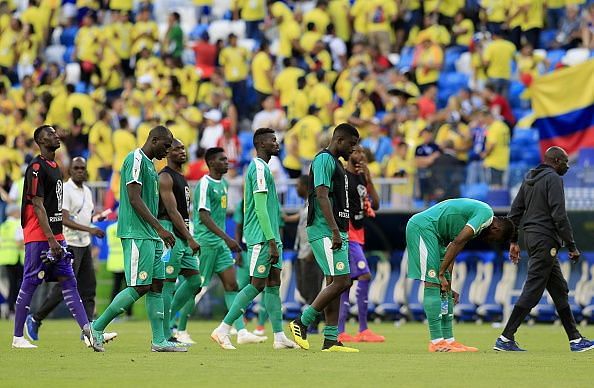 Dejected Senegal players after being knocked out of the World Cup