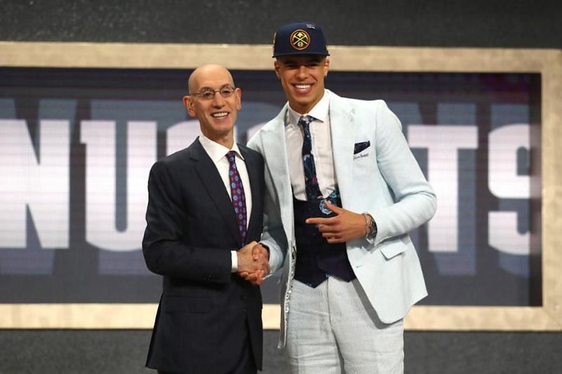 Michael Porter shaking Adam Silver&#039;s hands as he gets drafted 14th