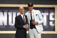 Michael Porter shaking Adam Silver's hands as he gets drafted 14th