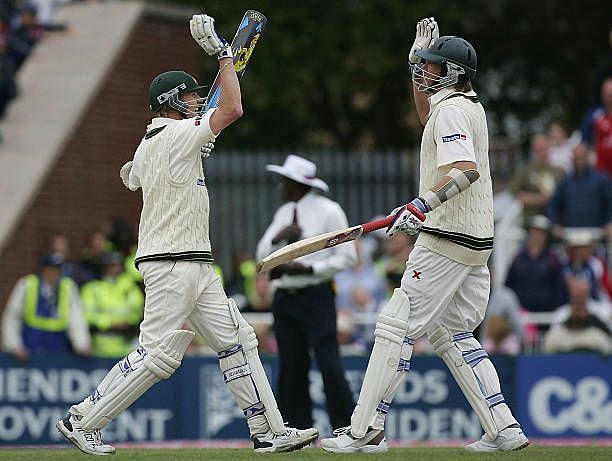 Brett Lee (L) and Glenn McGrath of Australia celebrate after holding on to draw