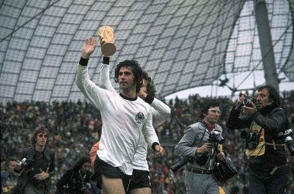 1974 World Cup Final. Munich, West Germany. 7th July, 1974. West Germany 2 v Holland 1. West Germany&#039;s Gerd Muller, scorer of the winning goal, waves to the crowd as the team parade the trophy on a lap of honour after the match.