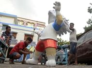 Indian artists paint the replica of FIFA World Cup Russia...
