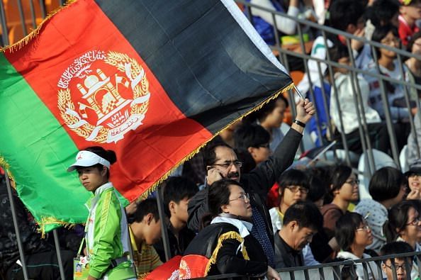An Afghanistan cricket fan celebrates hi