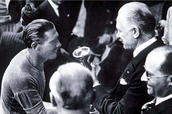 Meazza receives the World Cup from the French president following the 1938 final