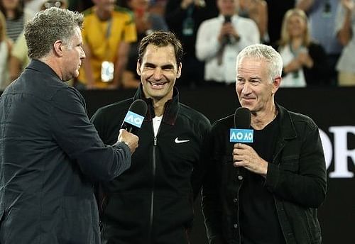 John McEnroe (Right) with Roger Federer (Center)