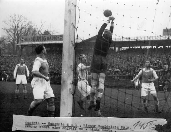 Soccer game Austria against Hungery (4:1). Zohrer ward off an attack. Austria, Vienna. Photograph around 1930.