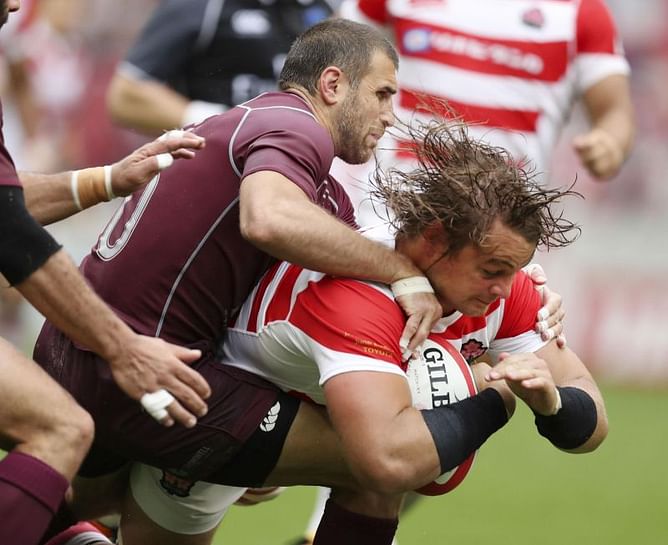 Japan overpowers Georgia 28-0 in rain