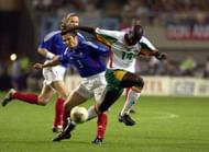 BT Football. FIFA World Cup Finals. Korea. Seoul. 31st May 2002. France 0 v Senegal 1. Senegal's Moussa Ndiaye passes Bixente of France.