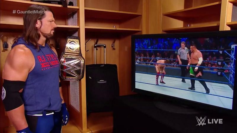 AJ Styles watches backstage as Bryan and Joe fight it out